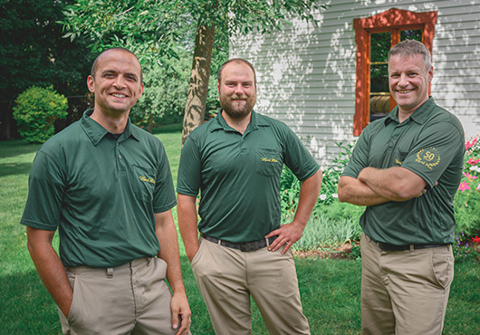 Weed Man experts on the lawn